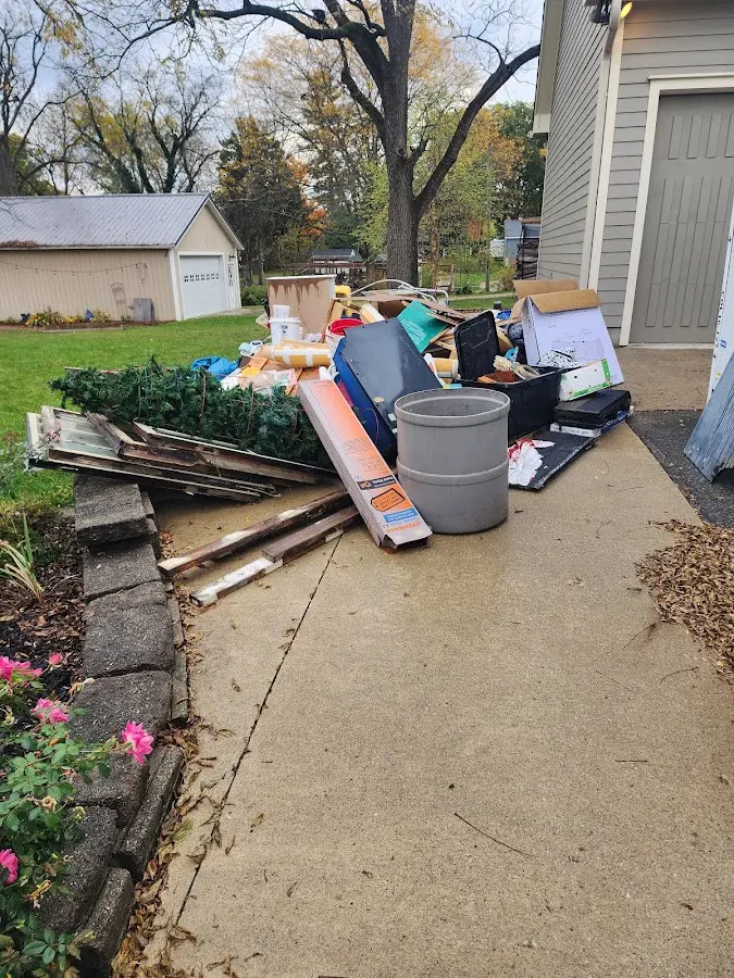 Dumpster being loaded with debris for Demolition Dumpster Rental in Cottage Lake